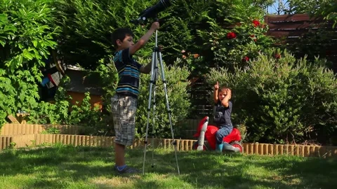 Young Brothers Exploring the Sky with a Telescope Stock Footage 312468671