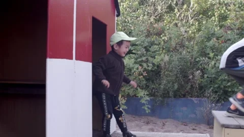 Young brothers having fun in a play house Stock Footage 221100833