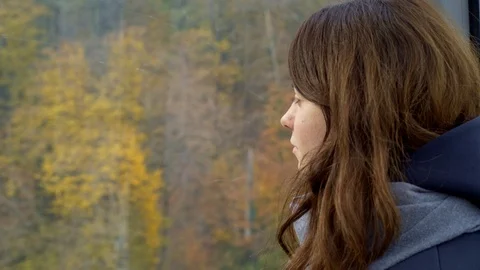 Young brunette in a cable car 스톡 동영상 88560615