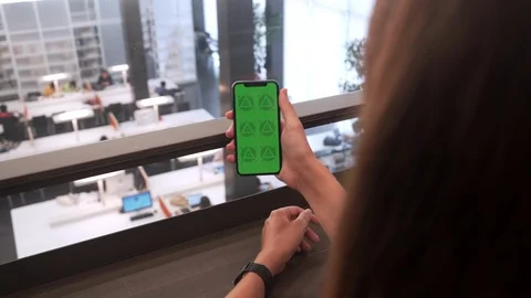 Young Brunette Female Using Mobile Phone with Green Screen Chroma Key. 4K Stock Footage 112306957