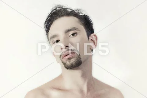 Young brunette man with a stylish haircut Stock Photos