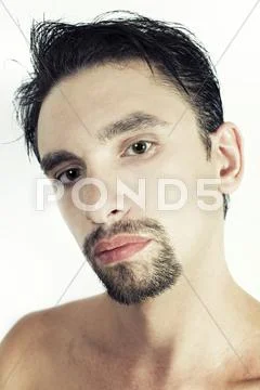 Young brunette man with a stylish haircut Stock Photos