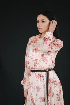 Young brunette model demonstating spring clothes in studio Stock Photos