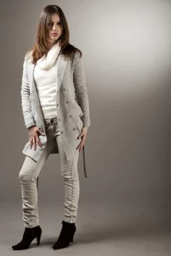 Young brunette model with her spring coat Stock Photos