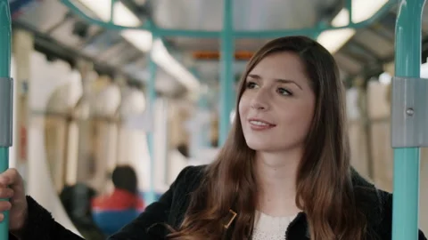 Young Brunette on the Train, Smiling and Standing up Video stock 131475784