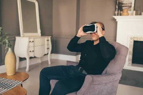 Young brutal man  Using VR In The Living Room Фото
