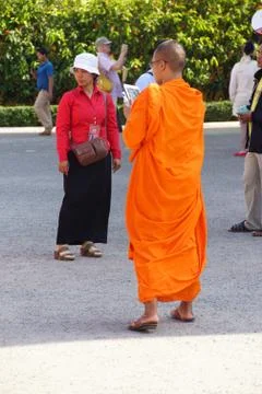 Young Buddhist monk checking  cellphone Stock Photos