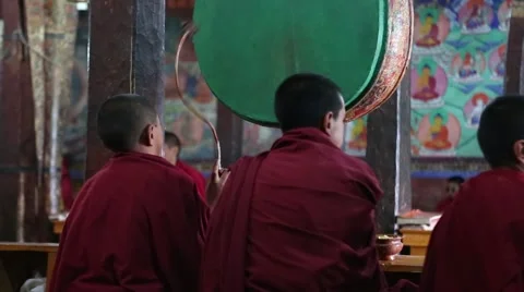 Young Buddhist Monk Hitting Drum at Morning Prayers Video stock 51847418