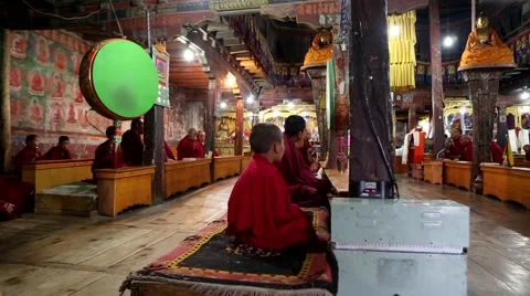 Young Buddhist Monks Playing Drums at Morning Prayers Video stock 51847494