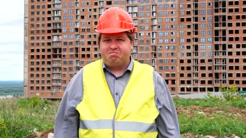 Young builder says No. By shaking his head. Worker says No, meaning No 스톡 동영상 111857651