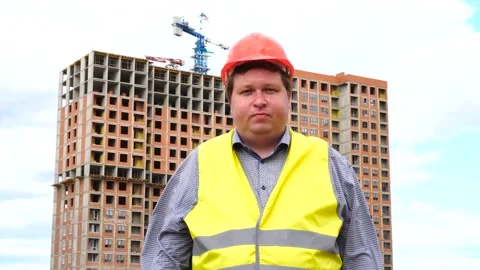 Young builder says No. By shaking his head. Worker says No, meaning No Stock-Footage 111878429