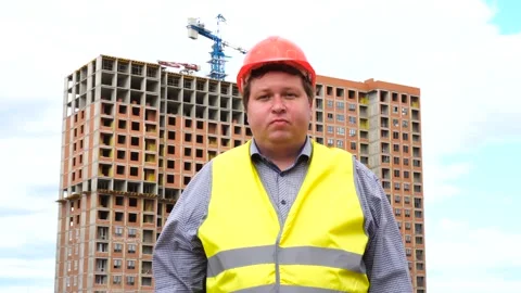 Young builder says Yes. By shaking his head. Worker says Yes, meaning YES 스톡 동영상 111878248
