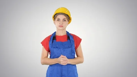Young builder worker woman presenting showing product with her hands from her Vídeo Stock 102289771