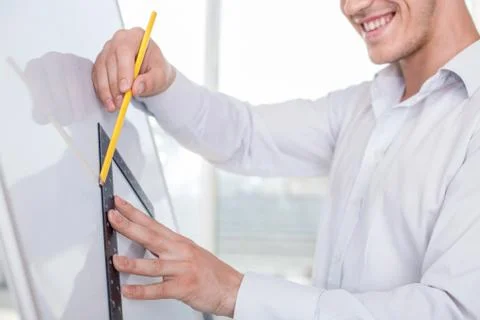 Young builder is working on a new project Stock Photos