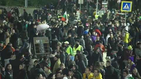 Young Bulgarians protest in the evening on a square in the center of Sofia Stock Footage 324563545