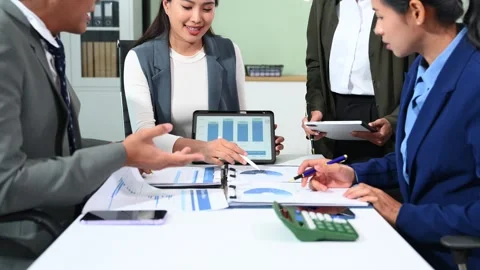 Young business creative team are brainstorming planning discussing while si.. Stock Footage 313858232