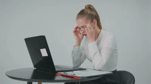 Young business lady working at the computer and she is having headache. Stock Footage 157935860