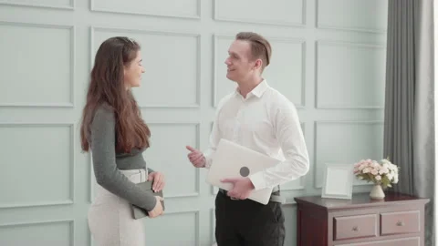 Young business man and woman handshake in the modern office, businessman and  Stock Footage