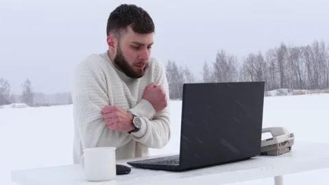 A young business man during a lockdown works on a computer. Office manager works Stock Footage 148500049