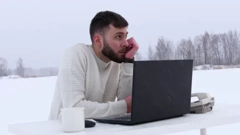 A young business man during a lockdown works on a computer. Office manager works Stock Footage 148500589
