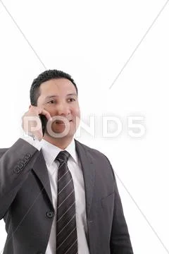 Young business man happy speaking mobile phone, isolated on white background Stock Photos