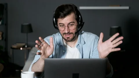 Young business man looking at camera webcam making conference video call Stock Footage 144374435