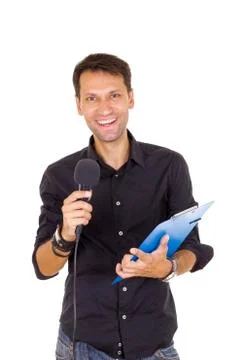 Young business man with notes announcing on microphone Stock Photos