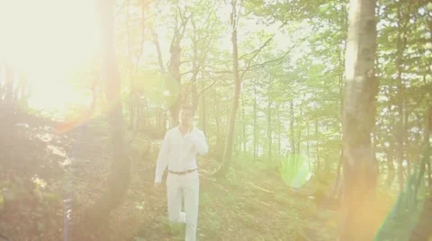 Young business man talking on cell phone at nature. Stock Footage 52323607