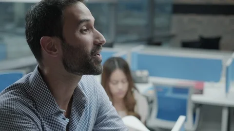 Young Business Man Talking At Work In Co-working Office Stock Footage 99103326