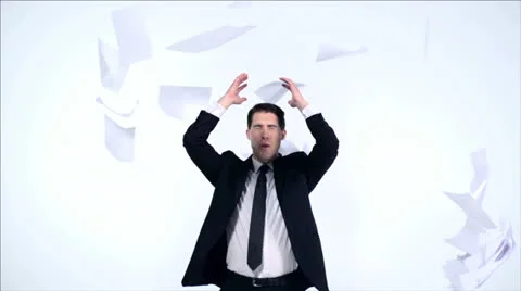 Young business man trying to catch pile of papers, Slow Motion Stock Footage 31819590