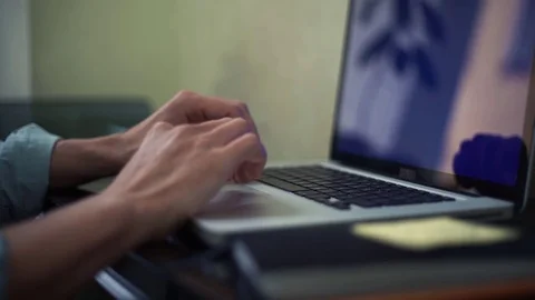 Young business man typing message using laptop with green screen Stock Footage 82928135
