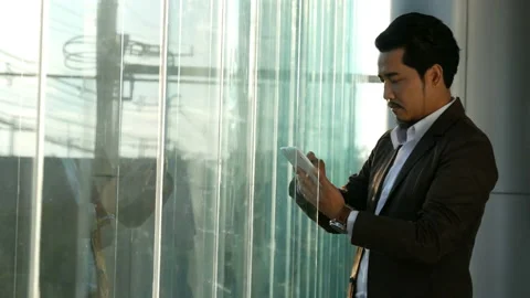 Young business man using tablet in office Video stock 131472845