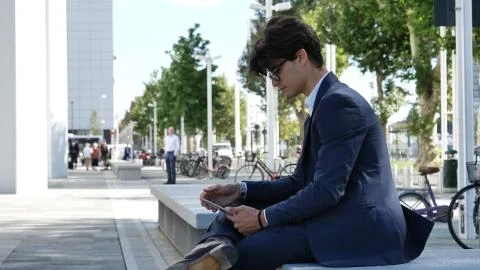 Young business man using tablet computer outdoor Stock Photos