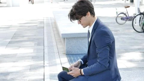Young business man using tablet computer outdoor Stock Photos