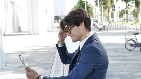 Young business man using tablet computer outdoor Stock Photos