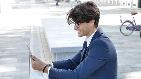 Young business man using tablet computer outdoor Stock Photos