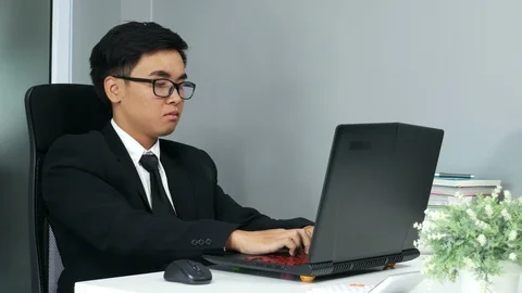 Young business man working problem using laptop Stock Footage 92681506