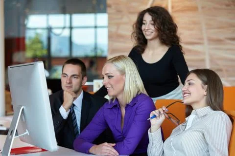 Young business team working on a computer in the office Stock Photos
