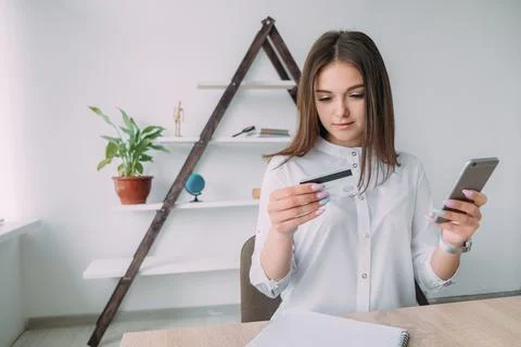 Young business woman and credit card Stock Photos