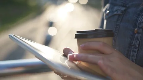 Young business woman walking on city streets and drinking coffee Stock Footage
