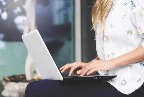 Young business woman working on a laptop. Stock Photos