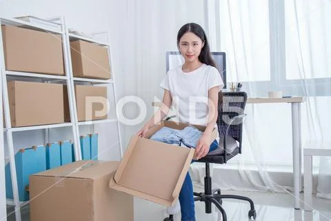 Young business woman working online shopping at her office Stock Photos