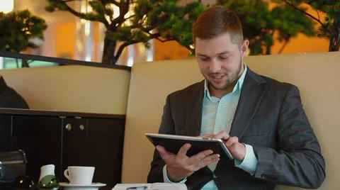 Young businessman after checking mail signs the document Stock Footage 30349404