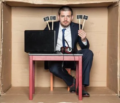 Young businessman asks for help at work Stock Photos