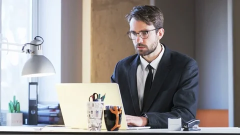 Young Businessman Cannot Believe in What He Has Read Stock Footage 70912988