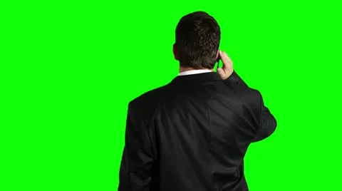 Young Businessman Cell Phone Looking Up Back Greenscreen 스톡 동영상 12568341