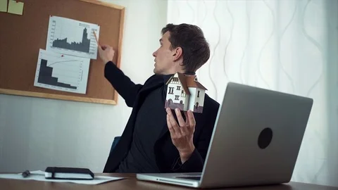 Young businessman chatting with customer using laptop computer Stock Footage 79901506