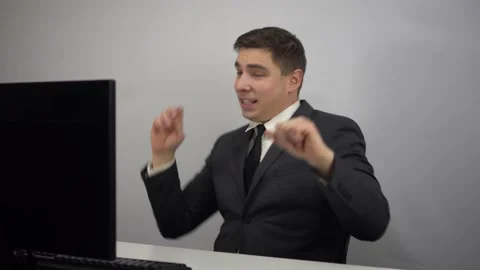 Young businessman dancing after work done. A man in a suit rejoices and dances Stock Footage 230708135