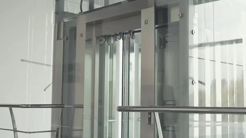 Young businessman with documents wait the elevator Stock Footage