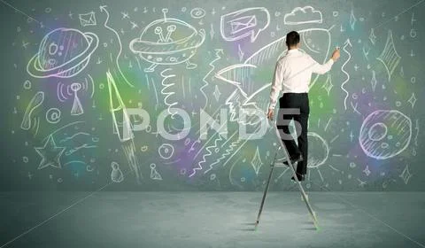 Young businessman drawing rocket Stock Photos